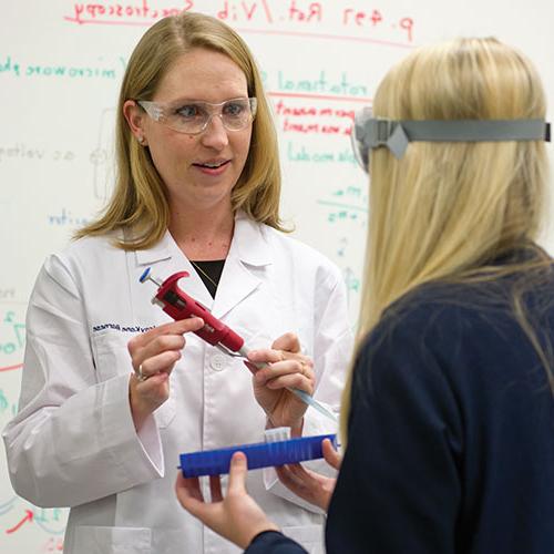 student and professor in lab